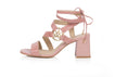 Embossed leather ankle-tie sandal with asymmetric straps and gold logo ornament, set on 65mm flared block heel